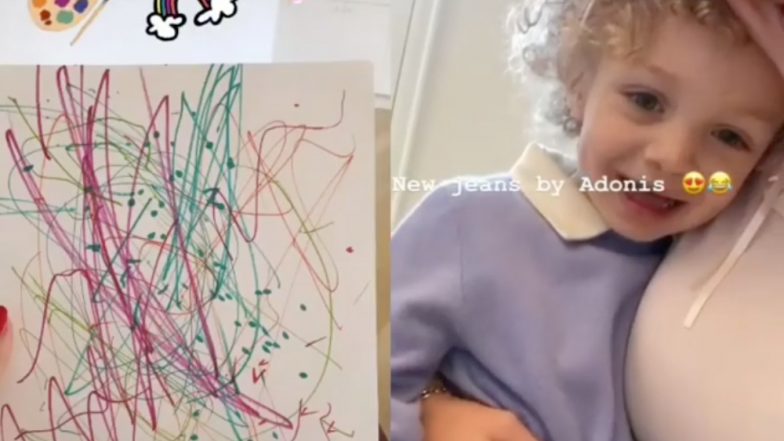 Drake's Son Adonis Is Absolutely Adorable As He Paints On A Pair Of Jeans In This Video