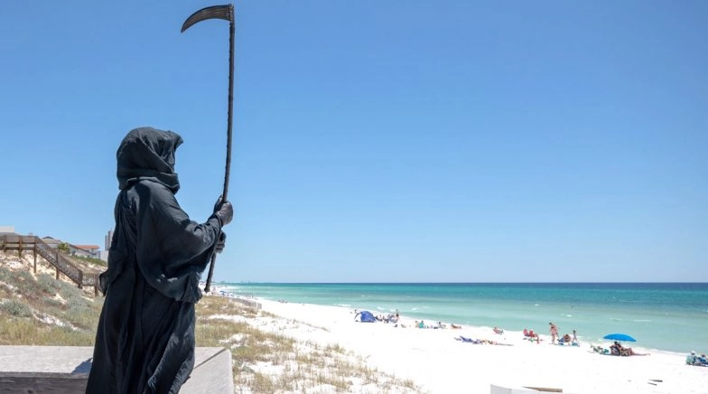 Florida Lawyer Dresses Up as Grim Reaper and 'Haunts' Florida Beaches to Remind Locals of COVID 19
