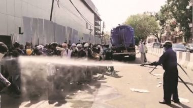 Delhi: Migrants Workers Waiting in Screening Line for Shramik Special Trains Sprayed Down With Disinfectant, Civic Body Says 'By Mistake' (Watch Video)