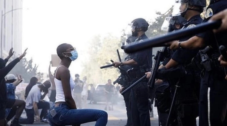 Pic of Woman Kneeling In Front of Policemen Wielding Guns During #BLM Protest in San Jose go Viral!