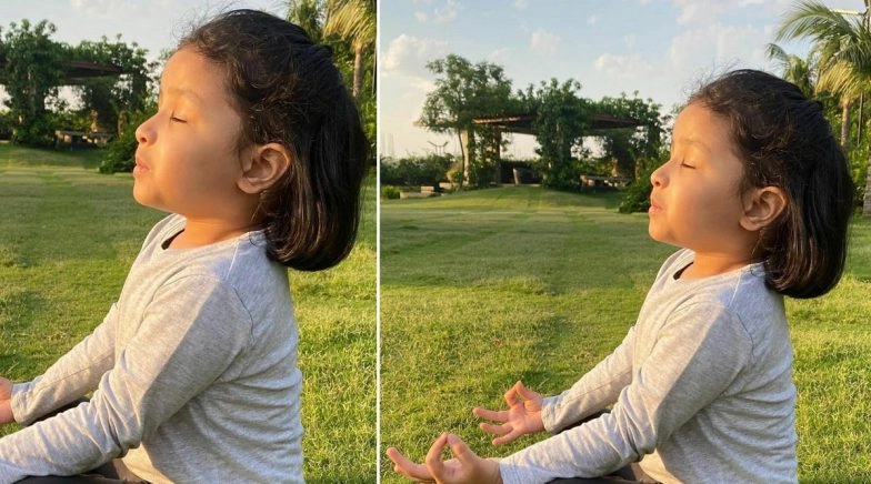 MS Dhoni's Daughter Ziva Dhoni Meditating in a Lawn Is the Cutest Picture on the Internet Today!