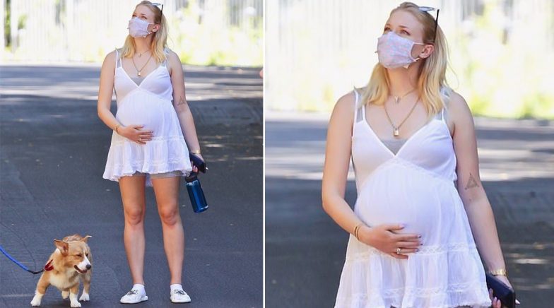 Sophie Turner Cradles Her Baby Bump As She Steps Out For A Walk With Joe Jonas and Her Parents