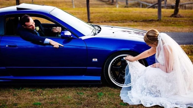 Bride Cleans New Husband’s Car Tyres With Her Wedding Dress, Unimpressed Netizens Slam the Couple Online (View Pic)