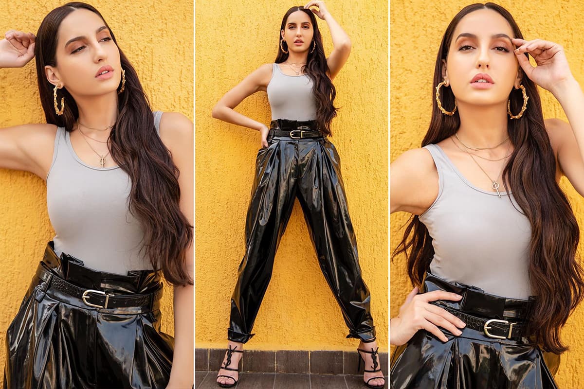 Nora Fatehi teams all-black top and leather pants with boots and