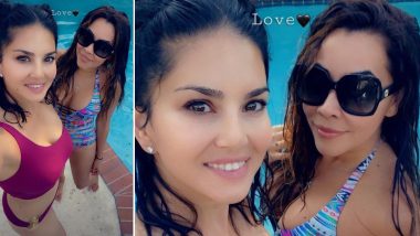 Sunny Leone is all things Charming and Hot in Her Magenta Coloured Beachwear (View Pic)