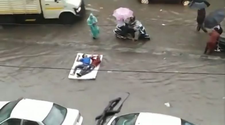 Video of Two Guys Floating on a Bed in Flooded Mumbai Rains is Going Viral