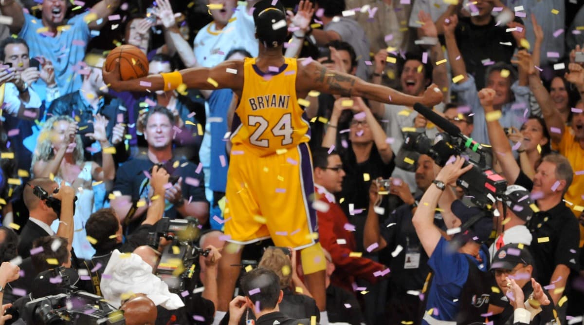 Nba Championship Wallpaper Kobe Bryant Holding Two Trophies Celebrating For  Championship Title Wallpaper  फट शयर