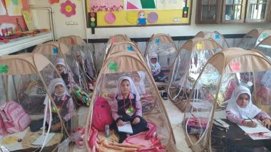 Iran Reopens Schools Amid COVID-19 Pandemic Concerns: Viral Pic Shows How Students Sit in Plastic Tents to Maintain Social Distancing in the Classroom