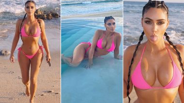 Kim Kardashian Oozes Sexiness In a Hot Pink Bikini While Chilling On a Beach (View Pics)