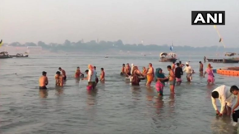 Devotees Take Holy Dip in Ganga on the Occasion of Sharad Purnima