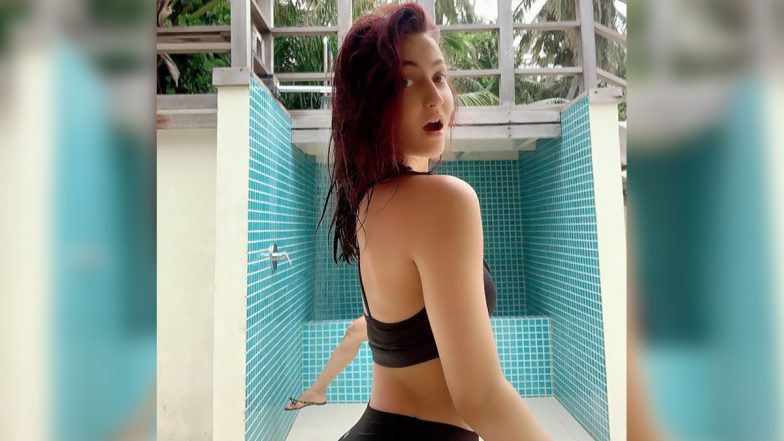 Elli AvrRam Raises the Heat Posing in a Black Bikini (See Pic)