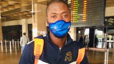 'In Mumbai Indians Kit for Karachi Kings'? Twitterati Divided After Sherfane Rutherford Arrives for PSL 2020 Playoffs Wearing MI’s Jacket and Face Mask