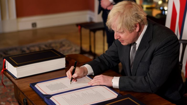 Boris Johnson Inks Post-Brexit Trade Deal With EU, Shares Photo of Him Signing the Agreement