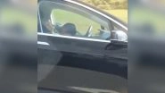 Tesla Car Driver and Passenger Both Caught Sleeping in Moving Vehicle, Autopilot Feature Sparks Mixed Reactions Online (Watch Viral Video)