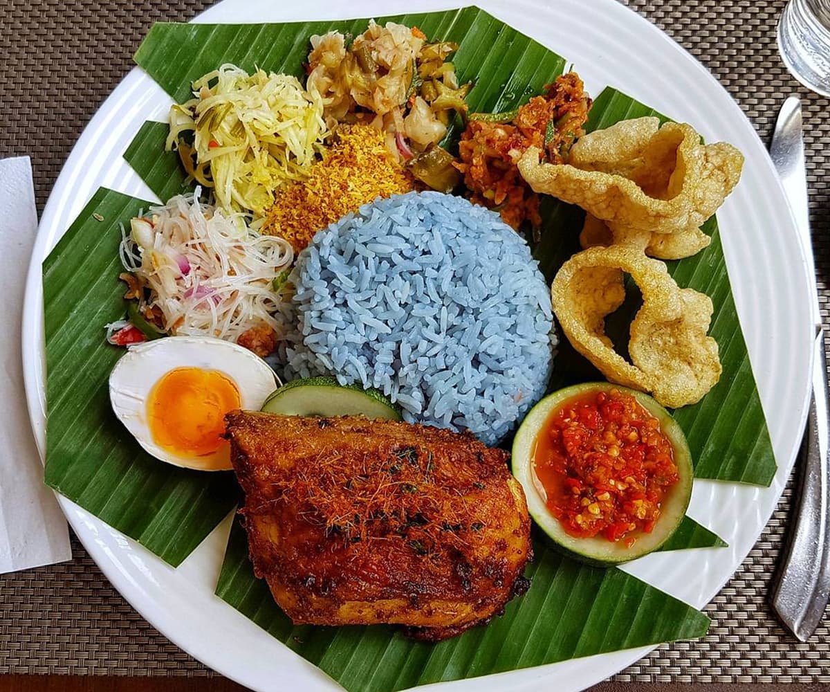 Krupuk or kroepoek, an Indonesian deep-fried crackers, are a must when eating Blue Rice. Krupuk or kroepoek, an Indonesian deep-fried crackers, are a must when eating Blue Rice.