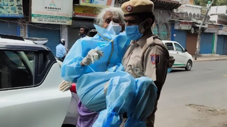 Delhi Police Personnel Carries Senior Citizen in His Arms For COVID-19 Vaccination