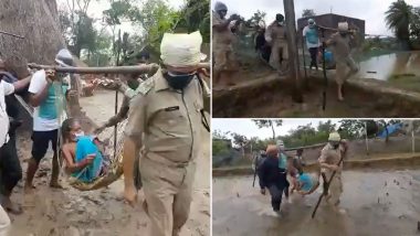 Cyclone Yaas: Police Officials Carry 91-Year-Old Woman To Shelter in Talchua Area of Odisha's Kendrapada District, Watch Video