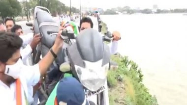 India News | Telangana Youth Cong Throws Bike into Hussain Sagar Lake Protesting Against Fuel Price Hike