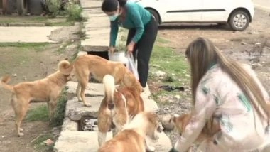 India News | Two Girls from J-K's Udhampur Feed Stray Dogs Amid Lockdown