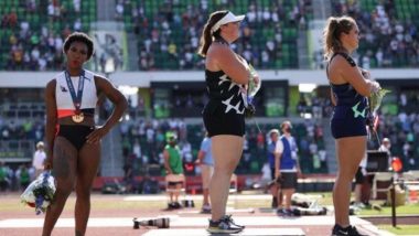 Gwen Berry Protests During Medal Ceremony of the Olympic Trials, Holds Up a T-Shirt Reading 'Activist Athlete' 