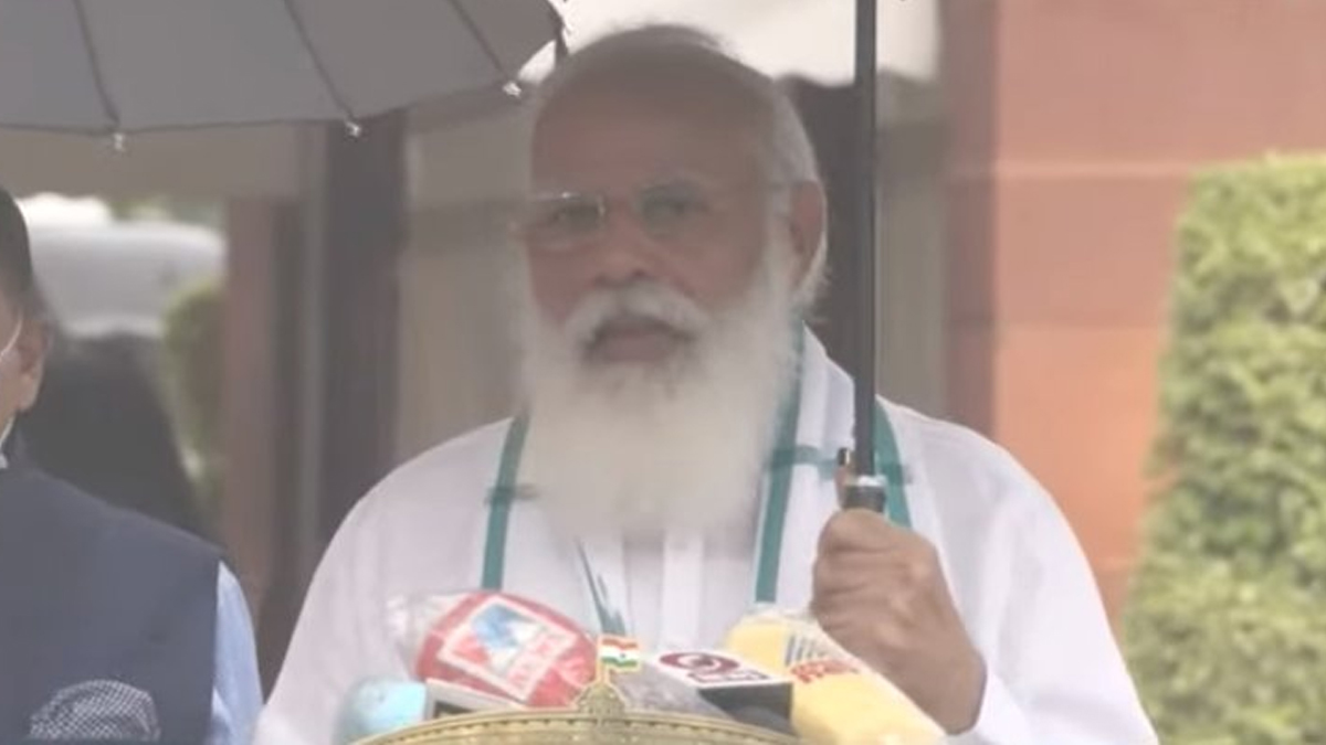 Holding umbrella by self, PM Modi addresses media in rain ahead of monsoon  session of parliament