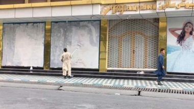 Afghanistan: Image of Man Covering Up Women's Pictures Painted on Walls in Kabul Goes Viral on Twitter