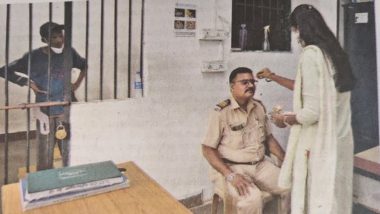 New Meme Template in Town! Yuva Sena Member Ties Rakhi to a Policeman at Mumbai Police Station on Raksha Bandhan While Man in Lock-Up Looks On; Newspaper Pic Goes Viral