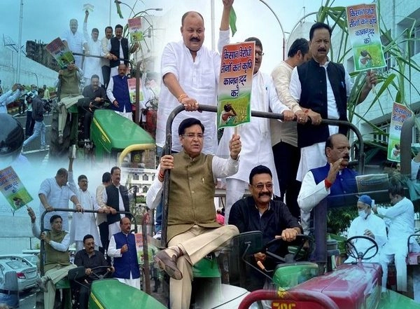 India News | Congress MLAs Arrive at Uttrakhand Assembly on Tractor with Sugarcane to Stage Protest