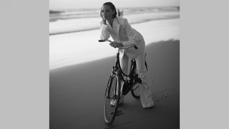 Gal Gadot Dons a White Power Suit As She Cycles by the Beach, Shares a Stunning Picture on Social Media