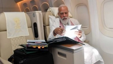 World News | PM Modi Goes Through Papers, File Work During His Journey to US