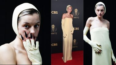 Emma Corrin Steals the Show in Yellow Miu Miu Gown, Tight Bonnet and Long, Black Nails at Emmys 2021 Red Carpet