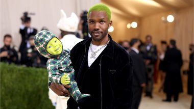 Frank Ocean Carries Green Robotic Baby on the Met Gala 2021 Red Carpet, View Photos