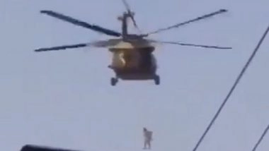 World News | Afghan Journalists Say Man Seen Hanging from Helicopter a Flag Installer, Wasn't Dead