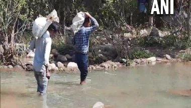 India News | Teachers in Chhattisgarh Village Walk 8 Km Every Day Carrying Ration to Ensure Mid-day Meal in Govt School