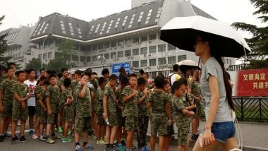 World News | China Adopts Law to Punish Parents for Children's 'bad Behaviour'