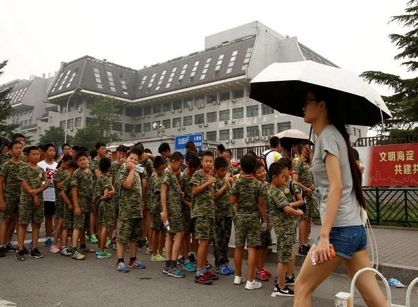 World News | China Adopts Law to Punish Parents for Children's 'bad Behaviour'