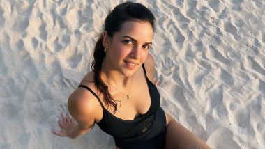 Natasa Stankovic Is Enjoying the Sun and Sand in a Stunning Black Swimsuit (View Pic)