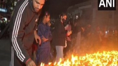 India News | J-K: People Light Diyas in Memory of Martyrs in Udhampur