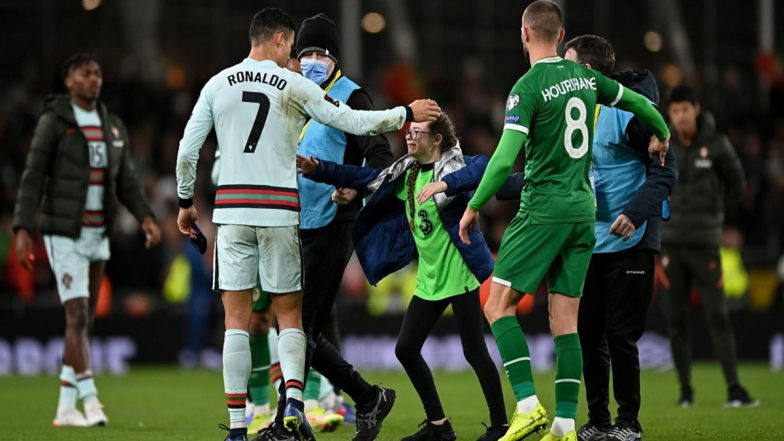 Cristiano Ronaldo Greeted by a Pitch Invader During Ireland vs Portugal, FIFA World Cup 2022 European Qualifiers, CR7’s Class Act Goes Viral (Watch Video)