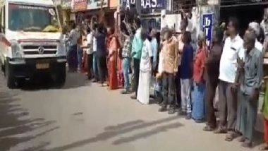 India News | TN: Locals Shower Flower Petals at Ambulance Carrying Mortal Remains of CDS Rawat, 12 Others Killed in Coonoor Chopper Crash