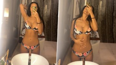 Esha Gupta Flaunts Her Sexy Body in a Black Floral-Printed Bikini and It’s Too Hot to Handle! (Watch Video)