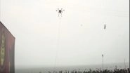 India News | High Tech Holy Bath: Drone Sprays Water on Devotees at Gangasagar