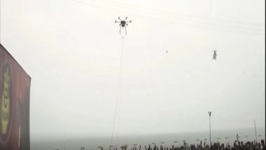 India News | High Tech Holy Bath: Drone Sprays Water on Devotees at Gangasagar