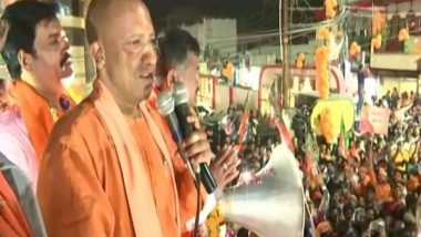 India News | CM Yogi Holds Roadshow in Bastion Gorakhpur, Calls 'Bhagwa' an Identity of 'Bhartiyata'