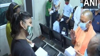 India News | Yogi Adityanath Inspects COVID-19 Vaccination Booth as Drive Begins for 12-14 Years Age Group Children