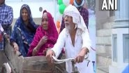 India News | UP Polls: Elderly Man Pulls Cart Carrying Wife, Disabled Women to Cast Vote in Azamgarh