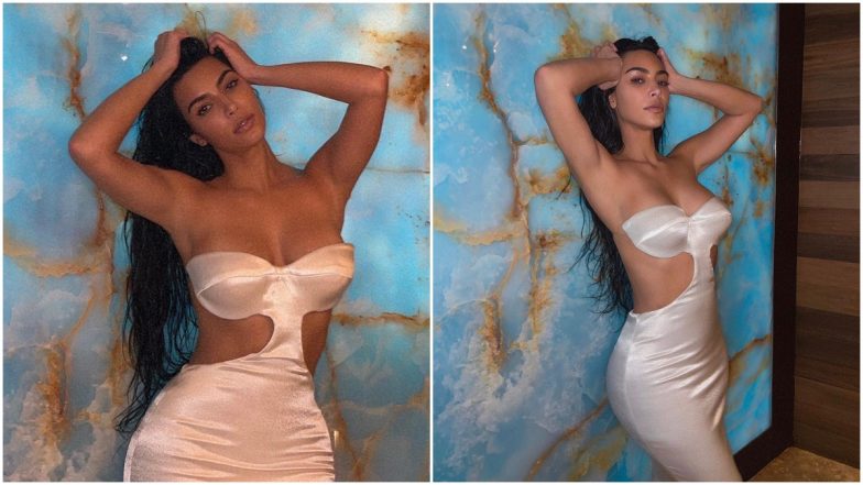 Kim Kardashian is a Seductress in Her White Satin Off-Shoulder Dress (View Pics)