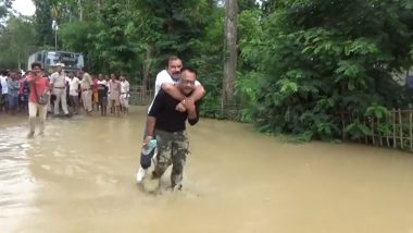 Assam Floods: Sibu Misra, BJP MLA From Lumding Assembly, Takes Piggyback Ride on the Back of a Rescue Worker; Watch Video