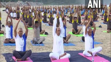 India News | Rajnath Singh Participates in Yoga Session with Navy Personnel at Karwar Naval Base