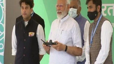 India News | Delhi: PM Modi Flies Drone During Inauguration of Two-day 'Bharat Drone Mahotsav'